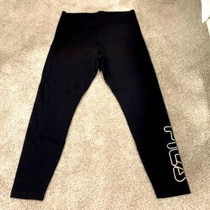 Never worn Fila leggings! Black leggings with Fila logo on left pant leg.